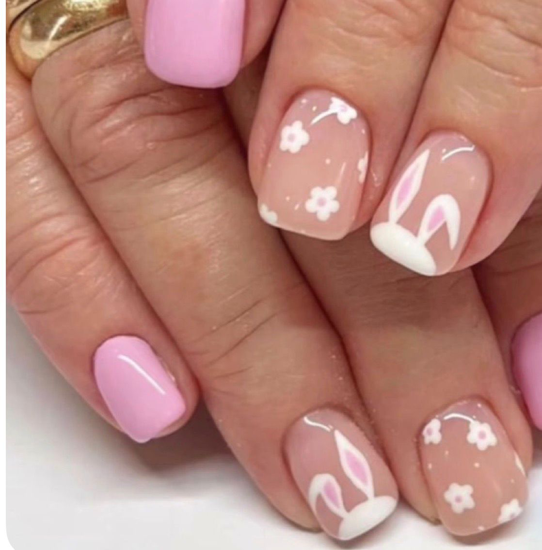 Pink Easter nails with cute bunny ears and white daisy flowers